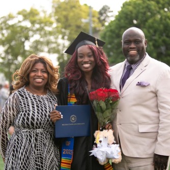 Graduate and family members pose together after ceremony