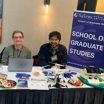 Geography and GIS faculty Keith Ratner (left) and Nick Geron (right) manning Salem State's vendor table at the NEARC conference