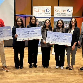 The first-, second-, and third-place finishers of the 5th Annual Salem State University Viking Business Pitch Competition stand with their prizes at the end of the competition Thursday night, April 3. From left: First Due Fire Exams, presented by Dav