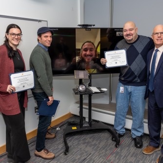 SSU ITS employees Marissa Hanson, David Walker, Jason Hagberg (on a HyFlex cart), assistant director Derek Barr, and President John Keenan