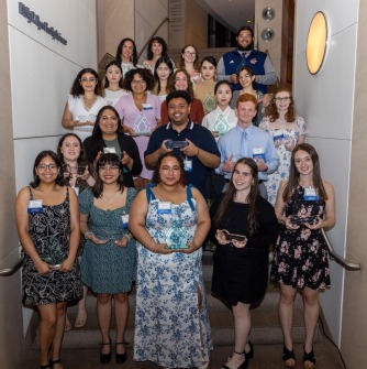 Award winners pose on the steps with their awards