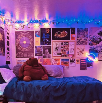 Interior of a Salem State dorm room, lit up with colorful lights 