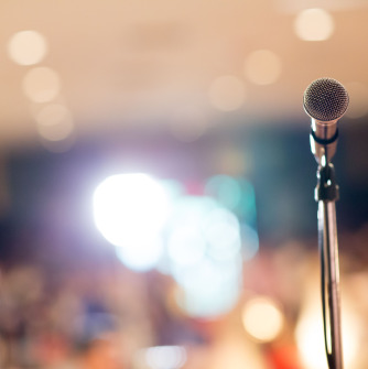 Microphone with blurred audience 