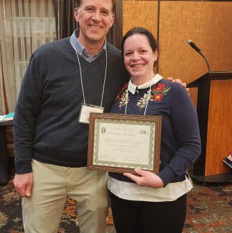 Dr. Green-Gavrielidis accepts the Collins Award for outstanding service to NEAS
