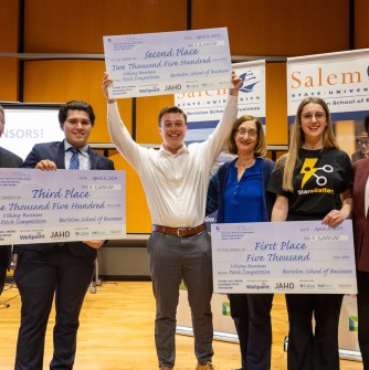 Winners of the 2024 Business Pitch Competition pose with their cash prizes and others involved with the program. Pictured from left: Don White, assistant dean of student success in the Bertolon School of Business; Christian Alquinta, third place fini