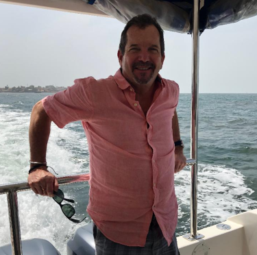 Alumnus Stephen Kelleher pictured on a boat during his travels.