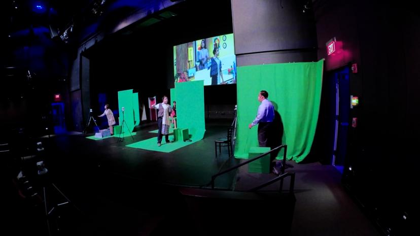 Photos of actors using socially-distanced green screens during the Salem State performance of "A Long Christmas Ride Home."