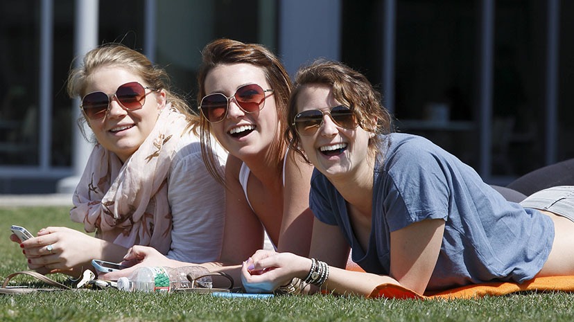 Salem State students enjoying the summer sun on the North Quad