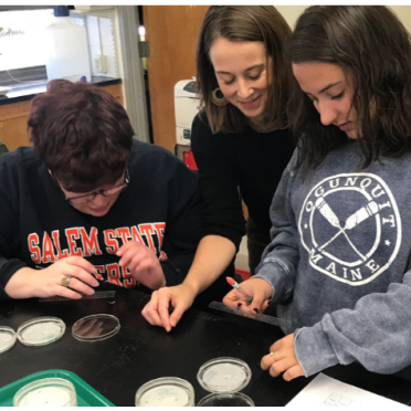 Students and a professor in the biology lab