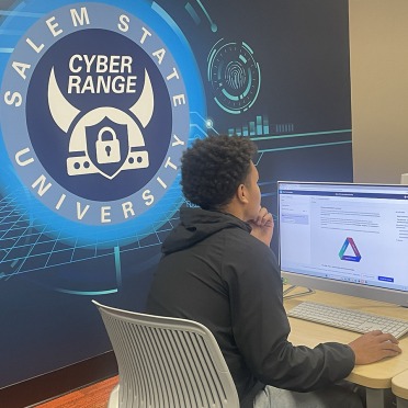 A student at a workstation in Salem State's Cyber Range
