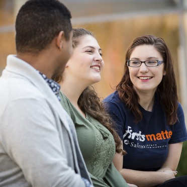 Three students on the quad